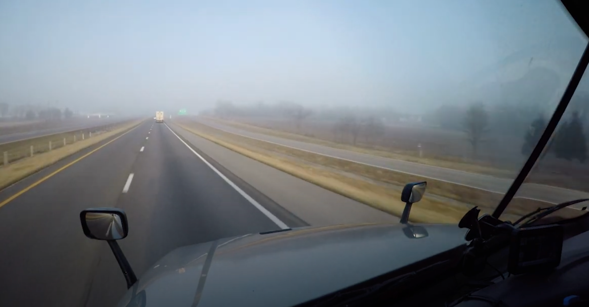 View out the windshield of a truck