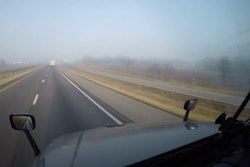 View out the windshield of a truck