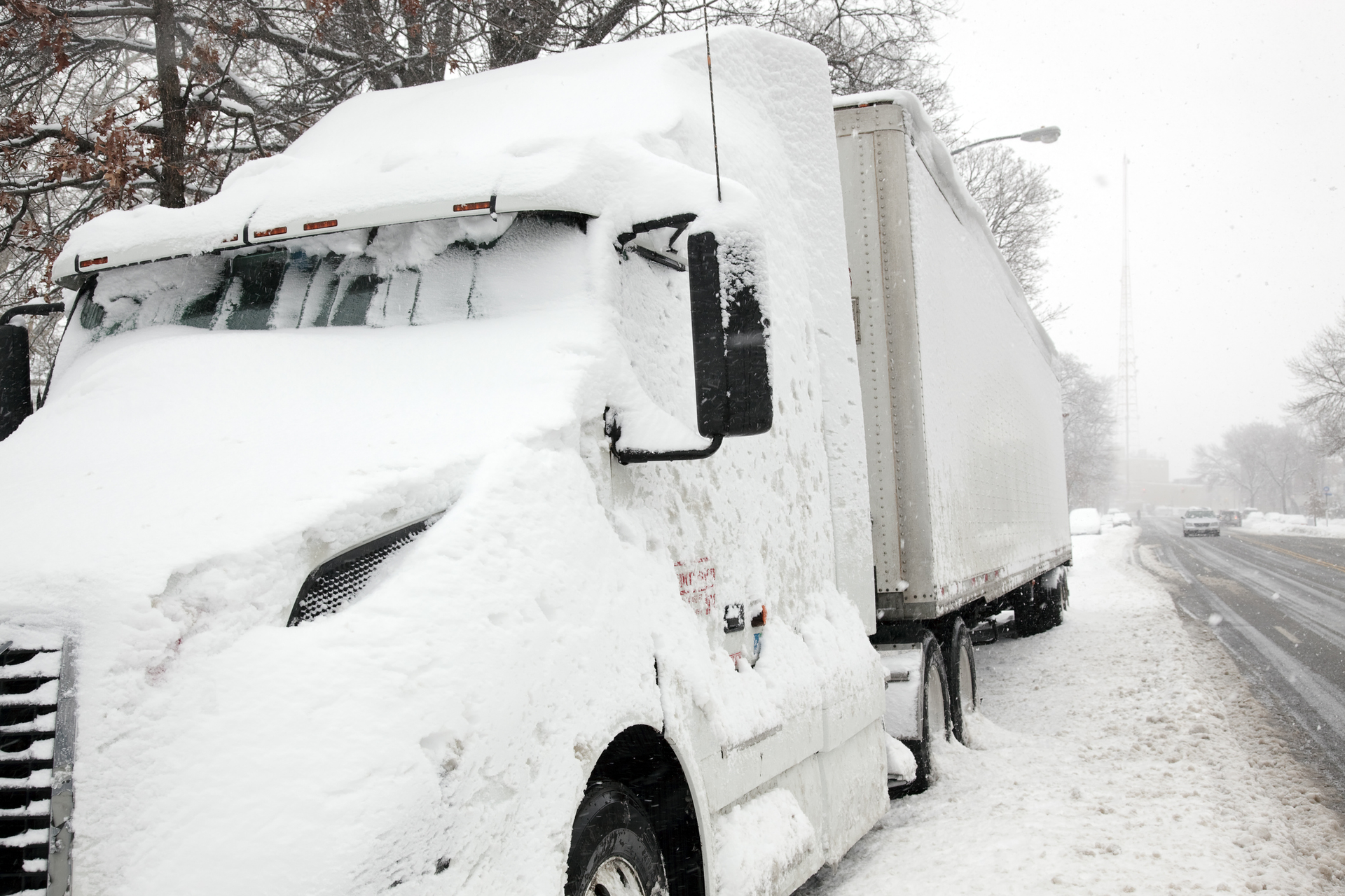 Semi covered in snow