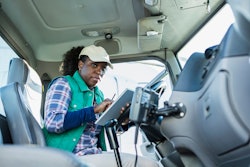 Truck driver on a tablet