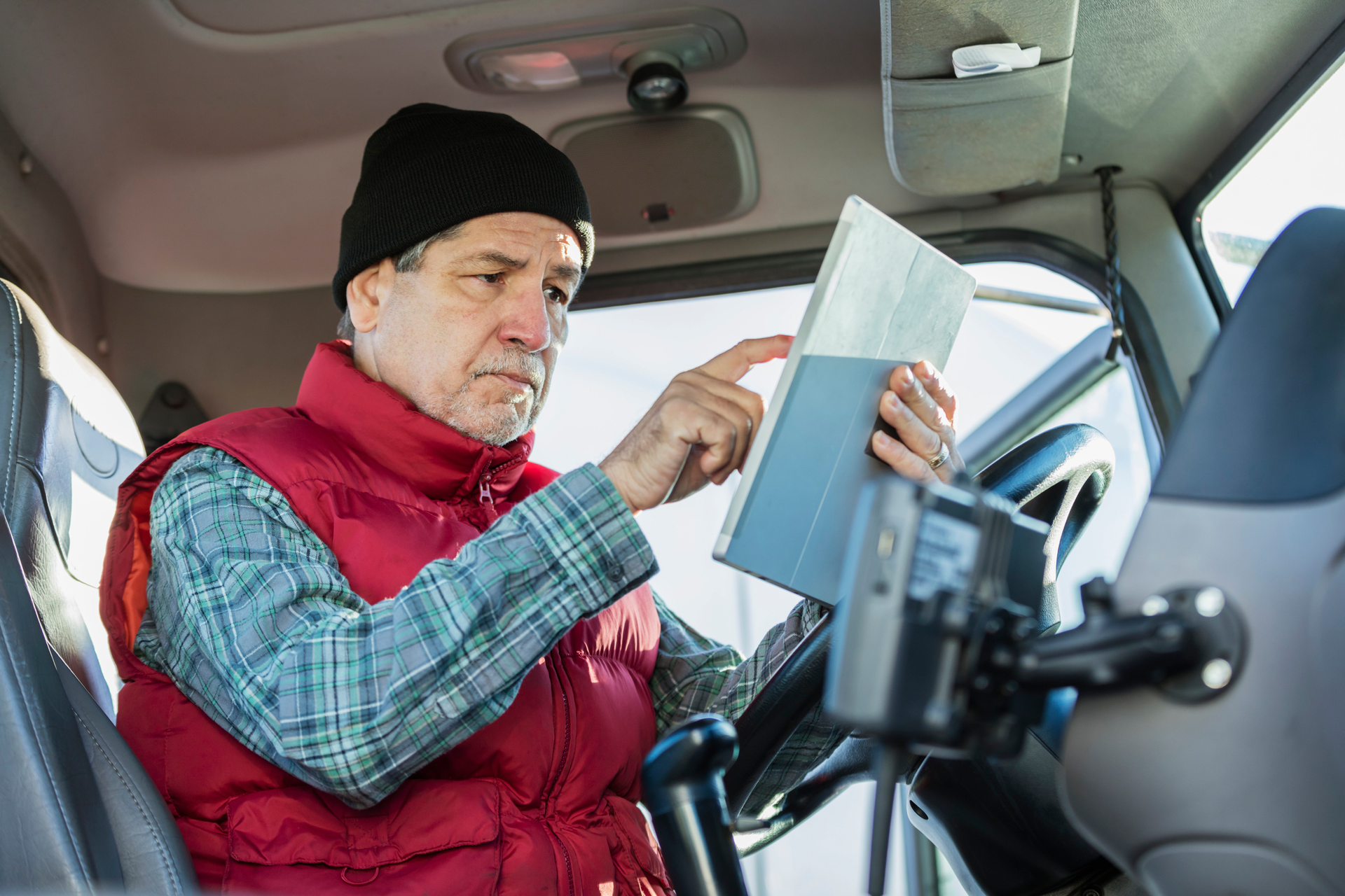 Driver looking at a tablet