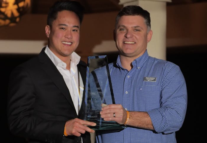 Tim Tran, vice president of systems and technology for JLE Industries, accepts the Innovator of the Year Award from CCJ Editor Jason Cannon.