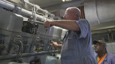 maintenance being done on NASA's Crawler-Transporter II