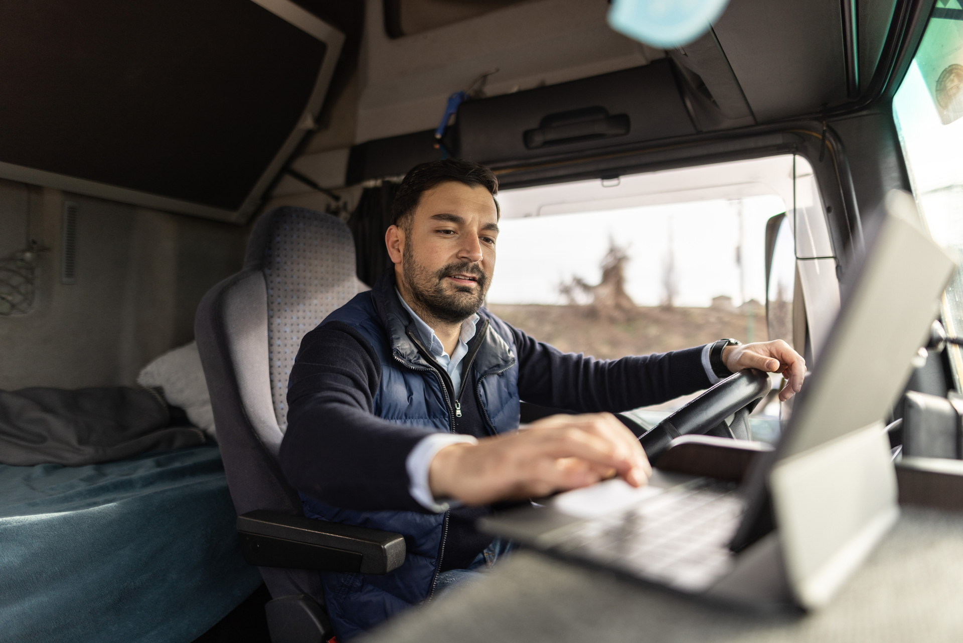 Truck driver using a laptop