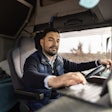 Truck driver using a laptop