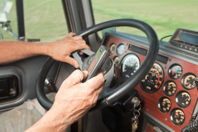 Truck driver using a device