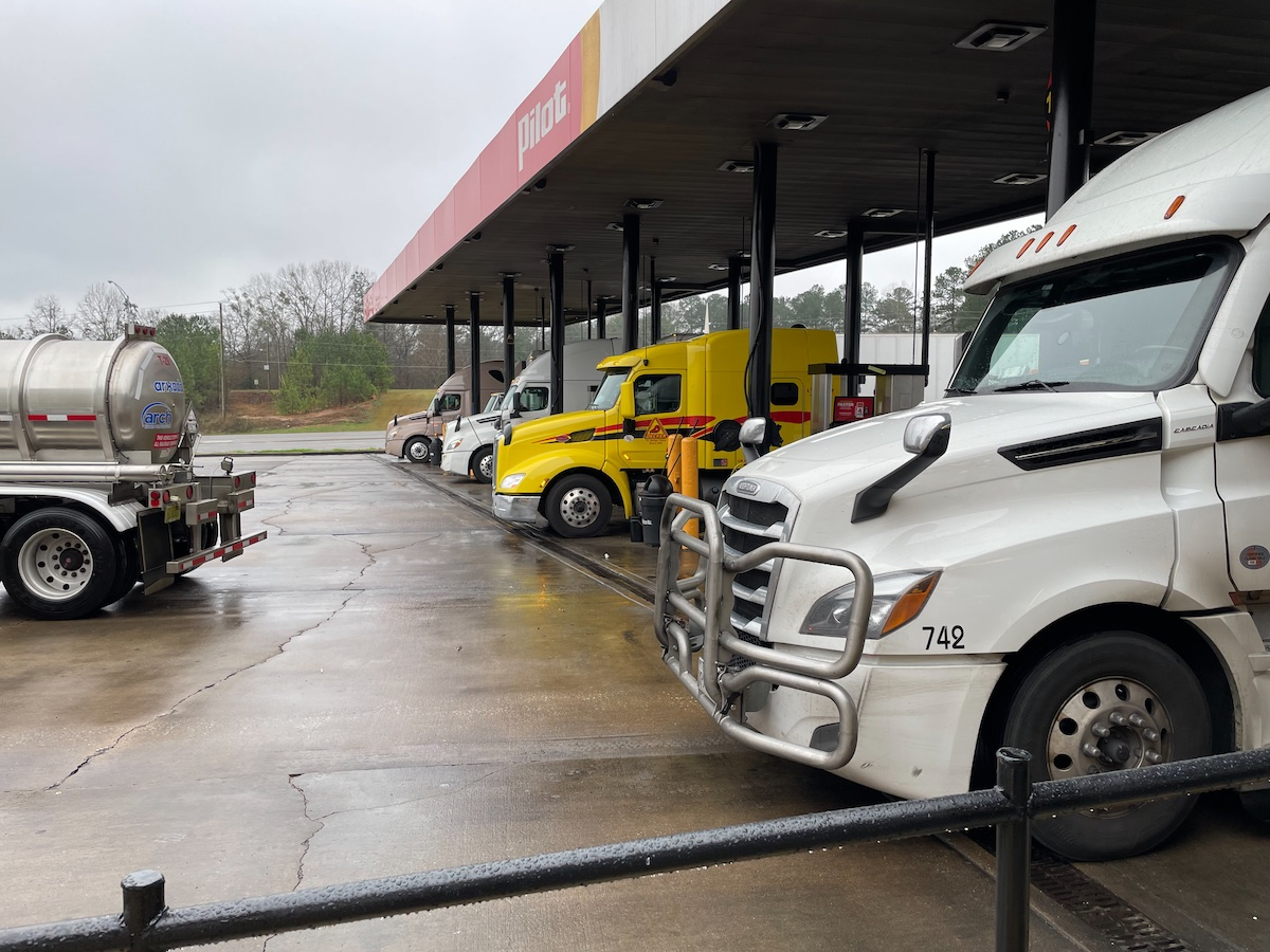 semi-trucks fueling at a pilot station