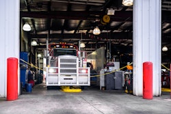 Semi-truck parked in a service bay