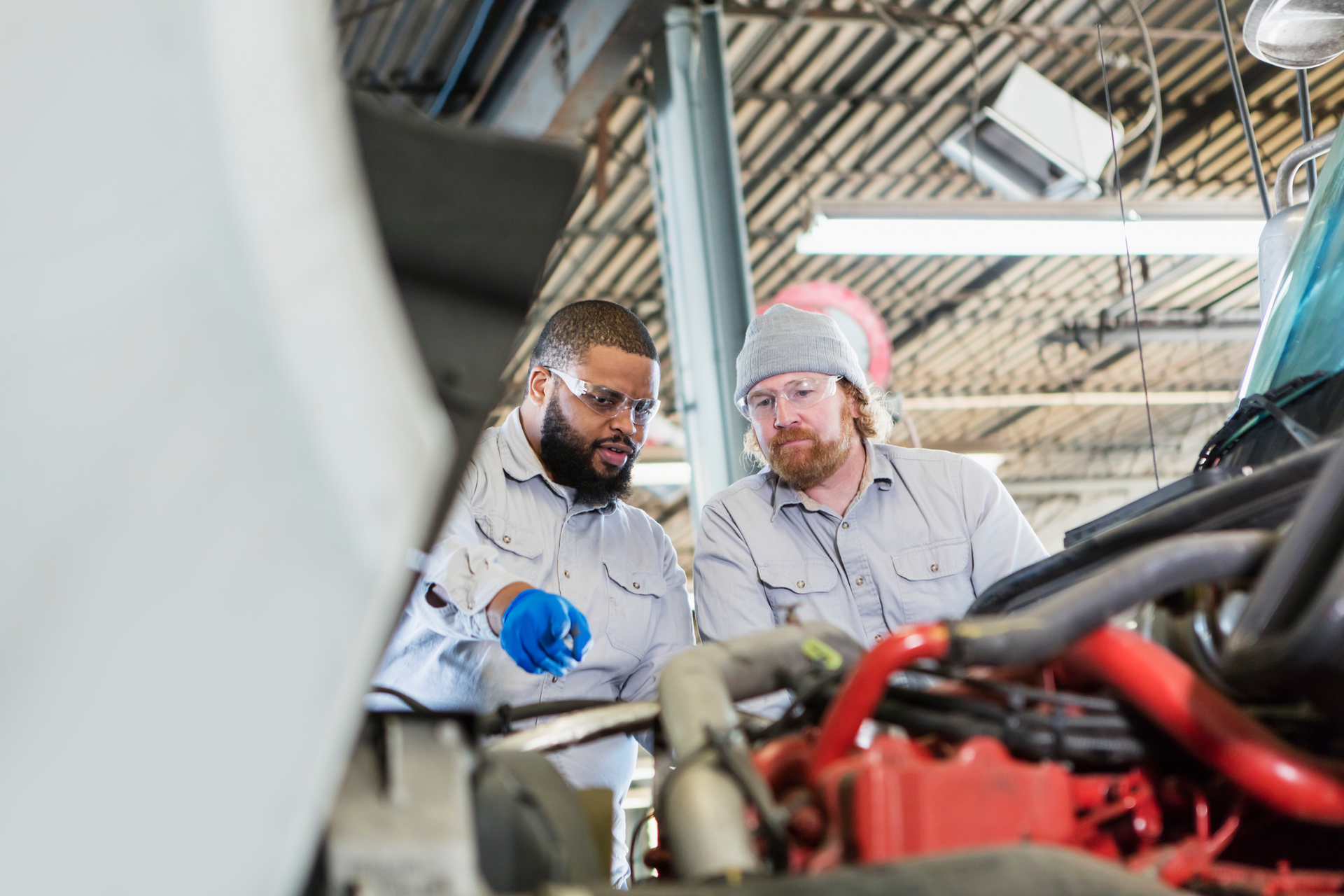 techs inspecting an engine
