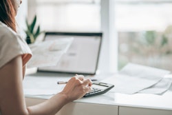 woman using a calculator