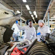technicians inspecting an engine