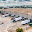 trucks being loaded at a warehouse