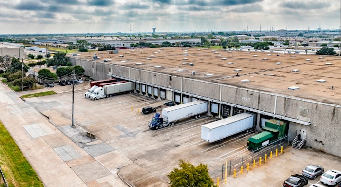 trucks being loaded at a warehouse