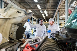 diesel technicians looking at an engine