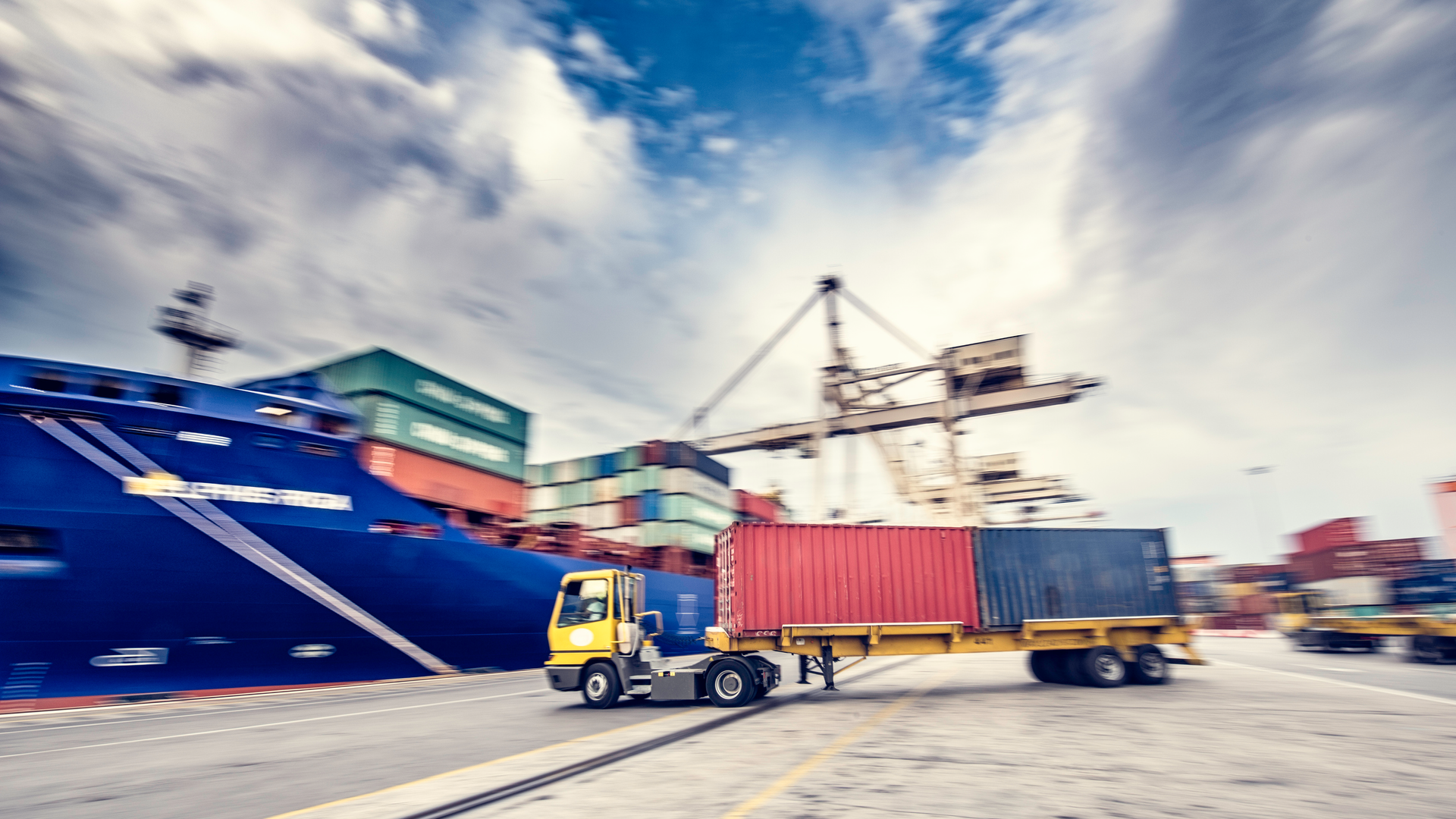 terminal truck hauling a container