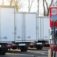 Commercial trucks at a charging terminal