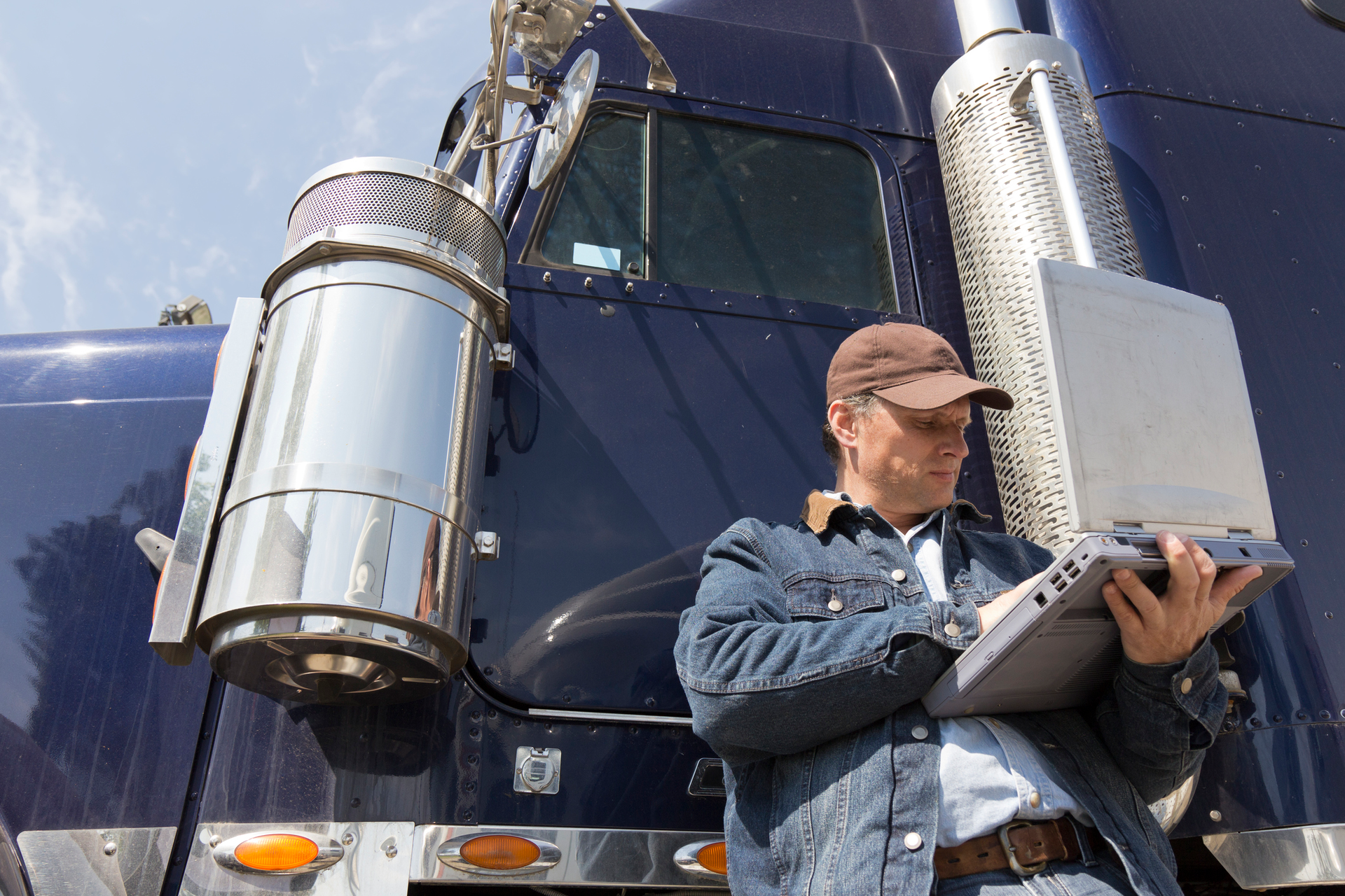 Truck driver using a laptop