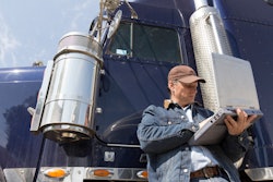 Truck driver using a laptop