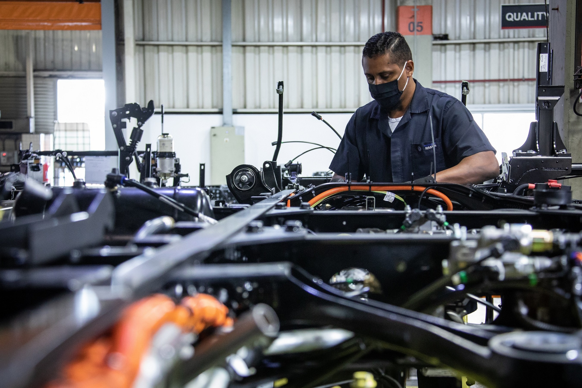 Worker assembling a truck