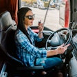 Woman trucker talking on a CB