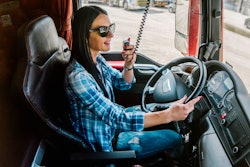 Woman trucker talking on a CB