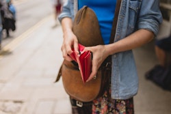 woman opening her wallet