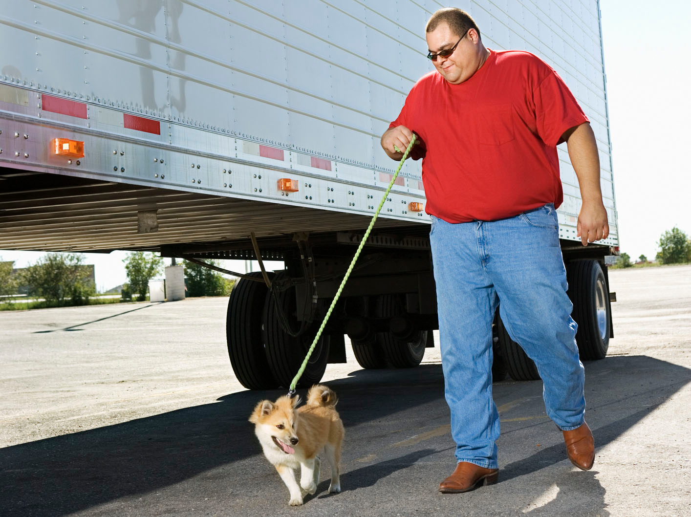 Truck driver walking his dog