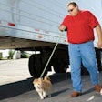 Truck driver walking his dog