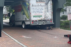 U-Haul truck stuck under historic covered bridge in Long Grove Illinois