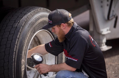 Michelin technician performing a tire check