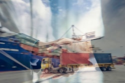 a truck moving a container towards a cargo ship with various shipping containers