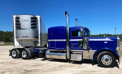 Blue Peterbilt and CAP reefer trailer