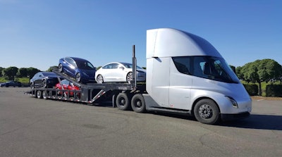 Tesla semi with an auto hauler trailer
