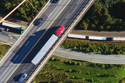 Truck passing over a train