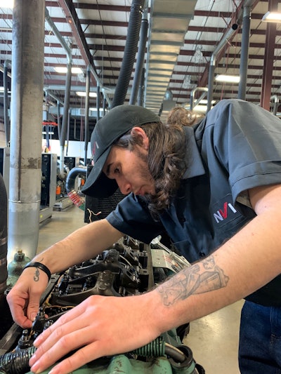 NVI student working on an engine