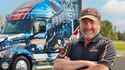 Schneider driver Jeff Waggoner with Ride of Pride Freightliner