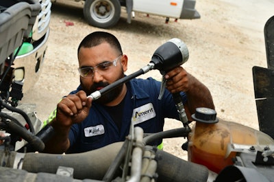 Amerit technician working under the hood of a truck