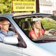 student driver in car with teacher