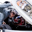Mechanic looking under the hood