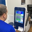 An on-site Fit to Pass health bot in Gulf Relay's gym measures blood pressure, weight and other health indicators. Participants in the weight loss program can keep up with their progress in a supporting app.
