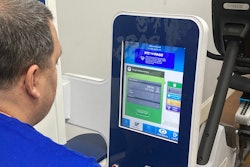 An on-site Fit to Pass health bot in Gulf Relay's gym measures blood pressure, weight and other health indicators. Participants in the weight loss program can keep up with their progress in a supporting app.