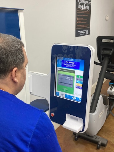 An on-site Fit to Pass health bot in Gulf Relay's gym measures blood pressure, weight and other health indicators. Participants in the weight loss program can keep up with their progress in a supporting app.