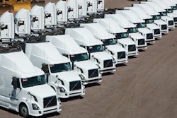 Group of trucks prepared for sale with Ritchie Bros.