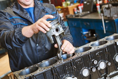 Mechanic tearing down an engine