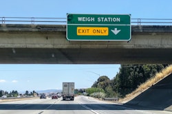 California highway with weigh station exit only sign