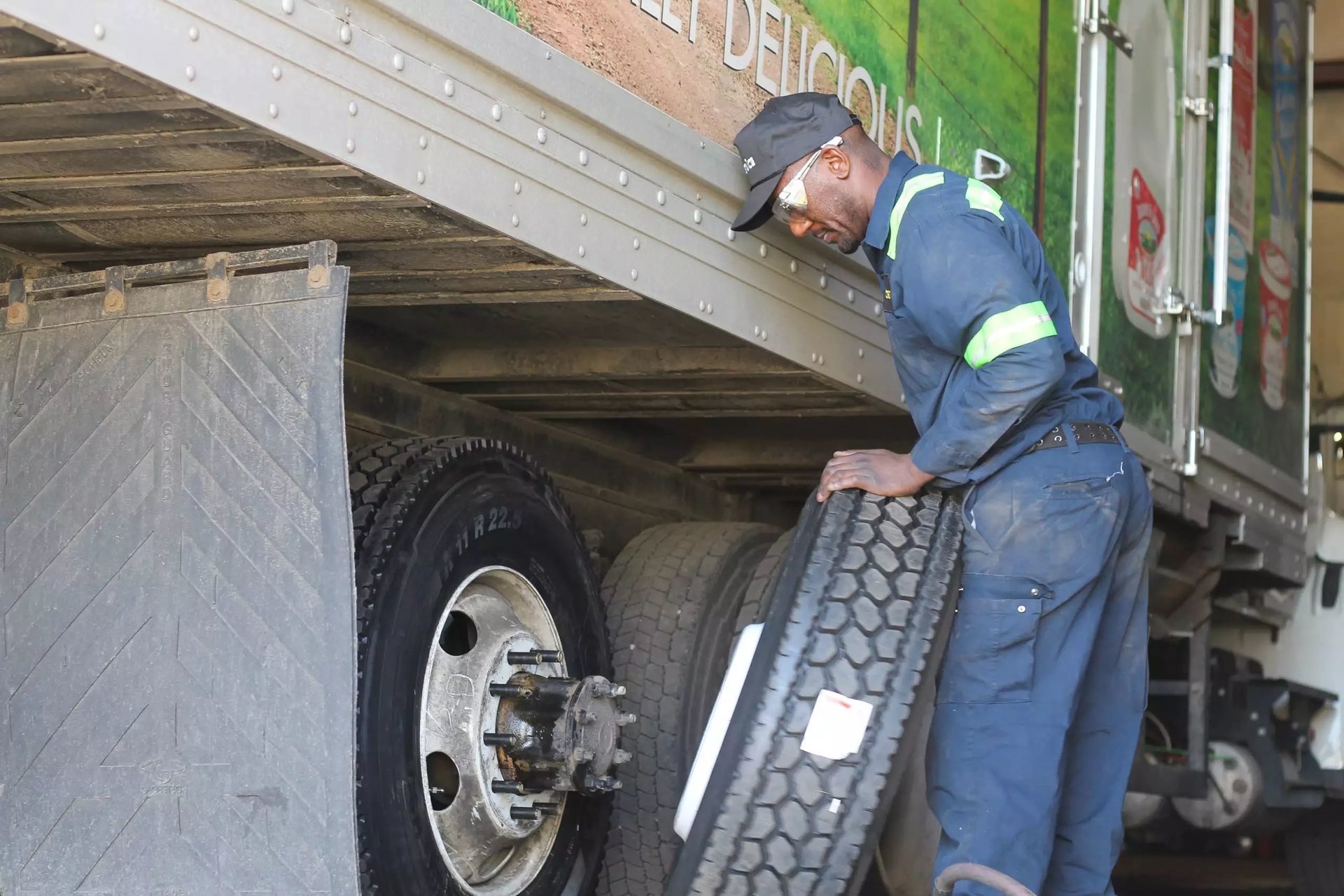 man changing a trailer tire