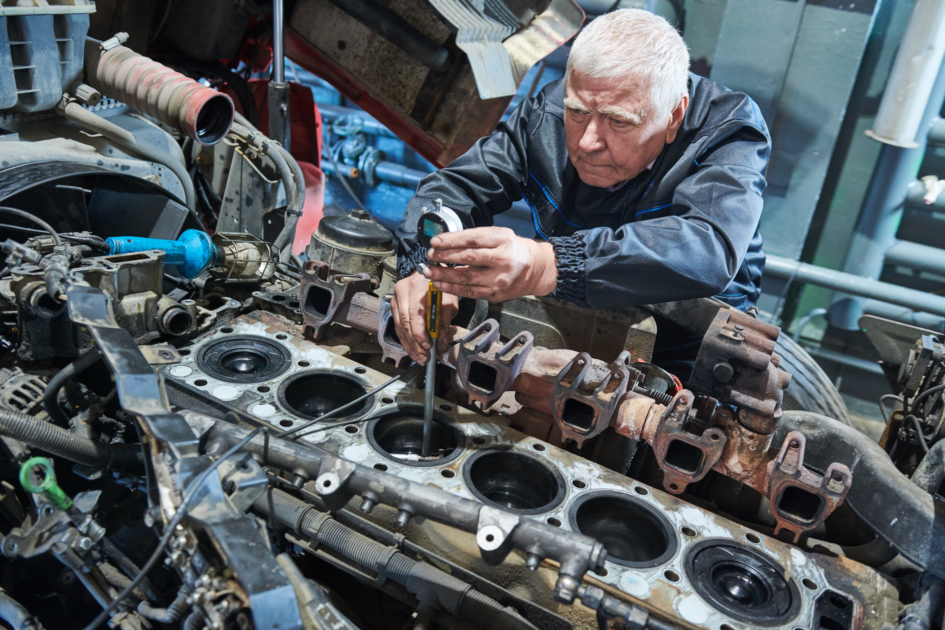 diesel mechanic working on an engine