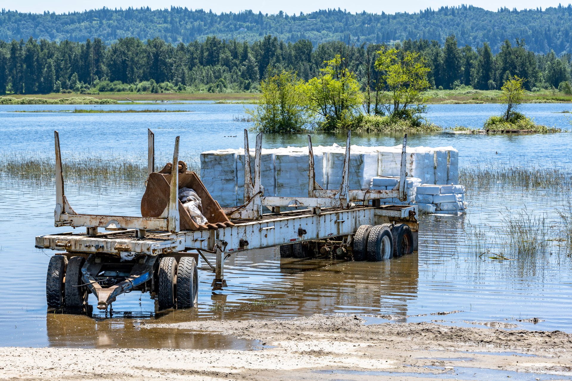 log trailer in a flood