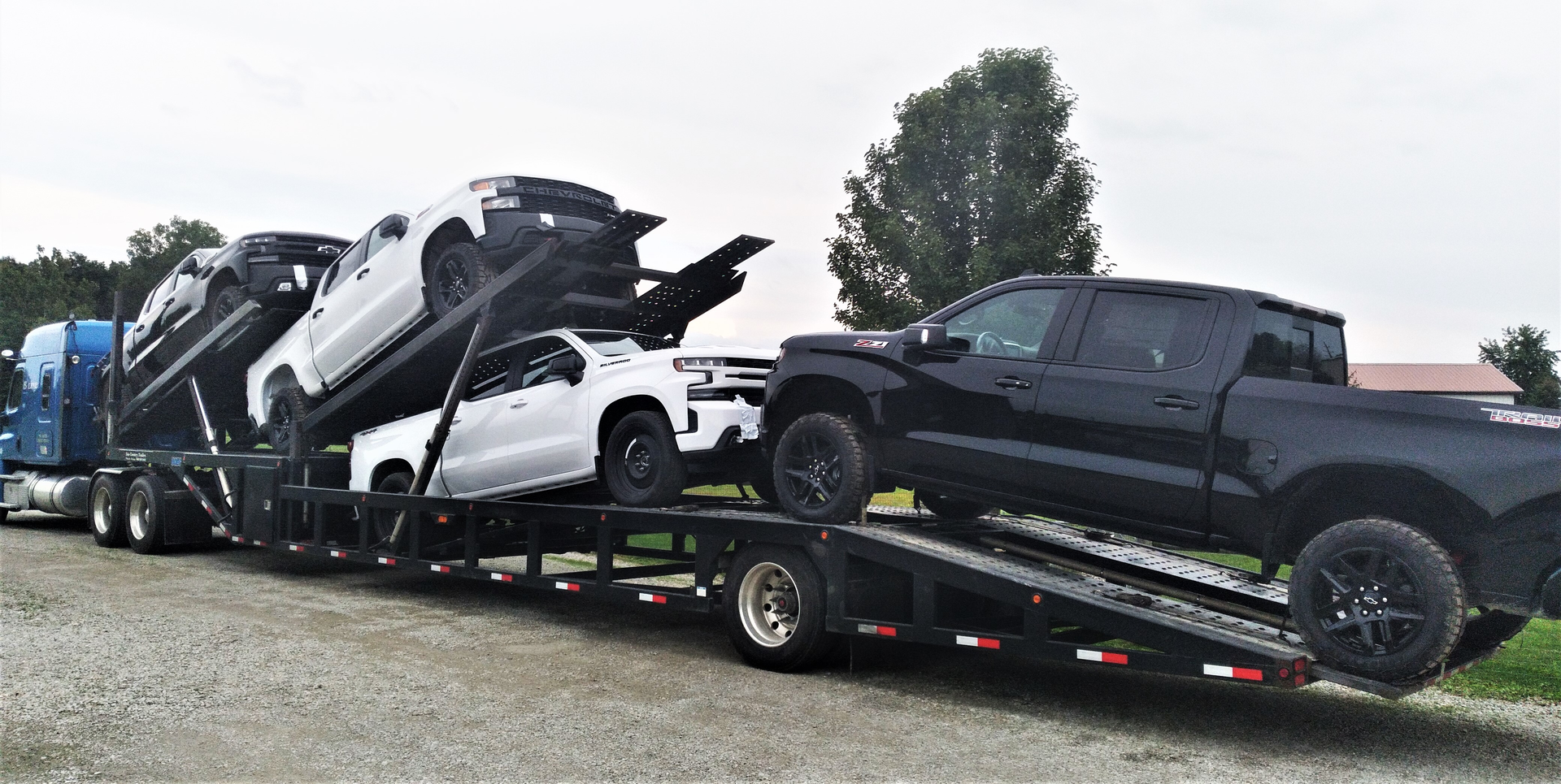 David Bunting's five-car Sun Country trailer loaded with pickup trucks