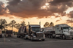 trucks parked at sunset